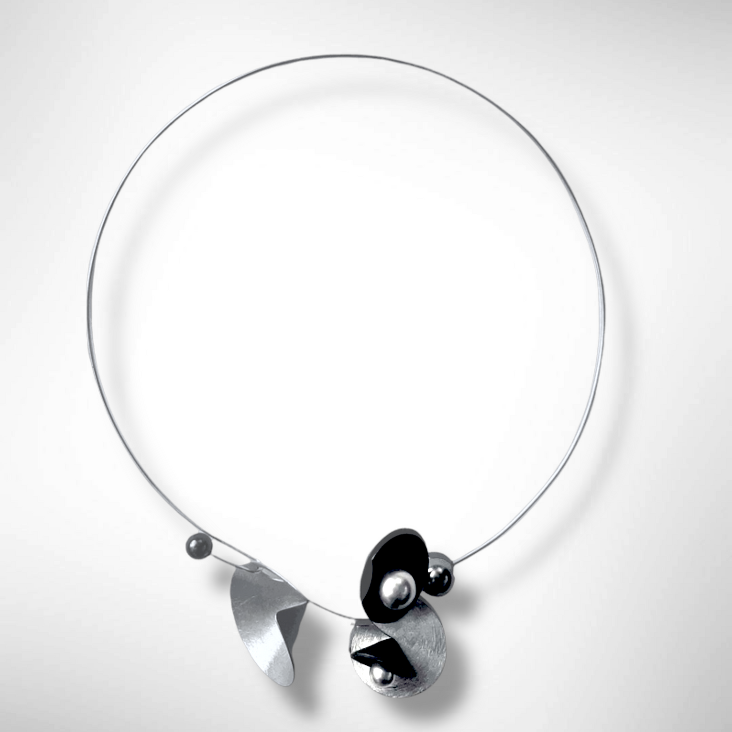 VOLUME 3 Multi-Directional Amplification Cones are at the Center of this Necklace from the SOUND Collection with Recycled Record Vinyl and Simulated Pearls