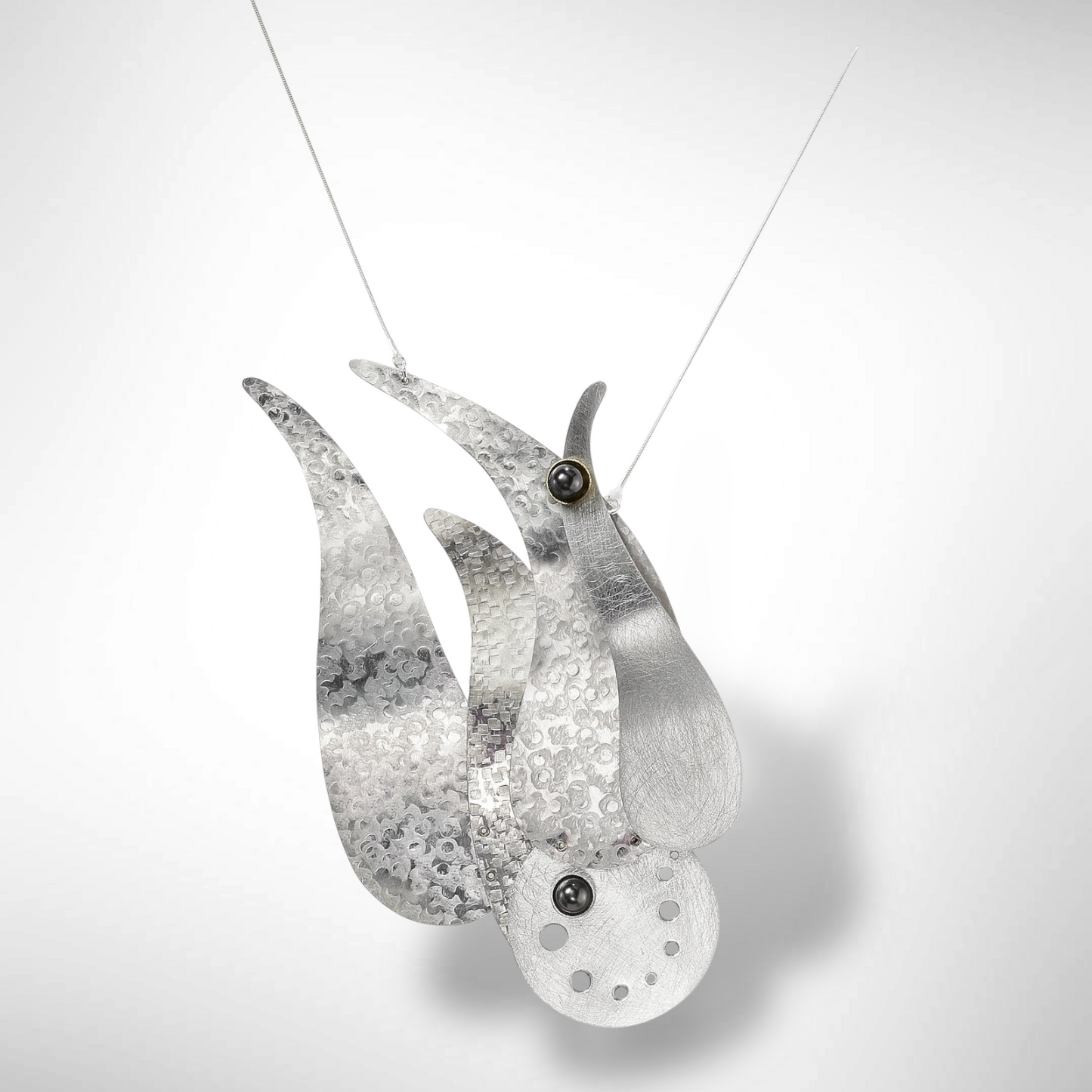 CREST Statement, Focal Necklace that evokes the movement of crashing waves from the WATER Collection