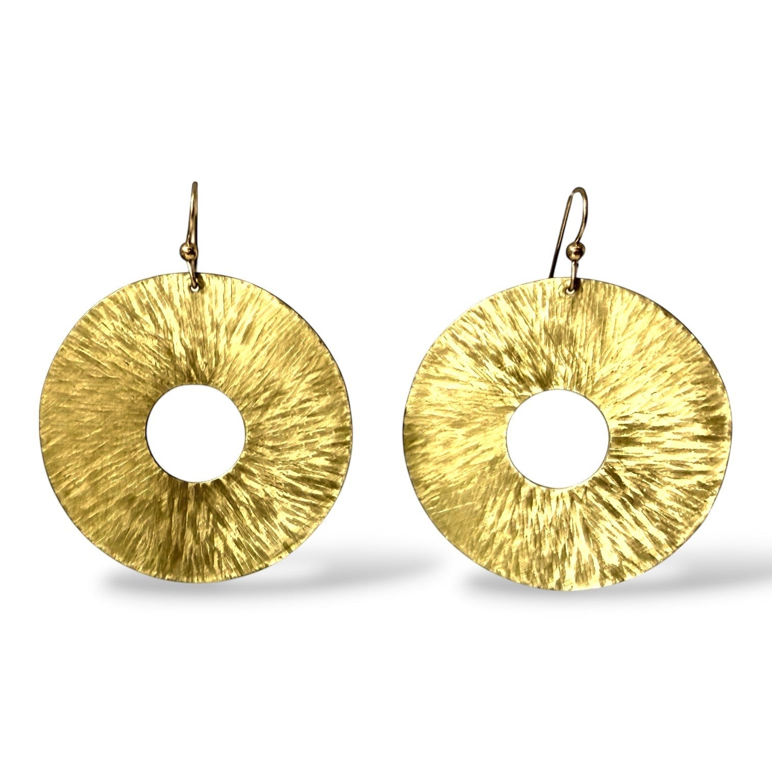 Chick Boss Large hammered brass disc earrings with a 2" diameter and sterling silver ear wires.