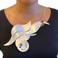SURF Show Stopping Statement Necklace featuring flowing waves and sea foam design with front clasp from the WATER Collection